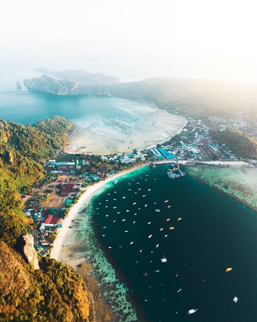 Aerial establishing shot of a coastal bay and resort town in Vietnam