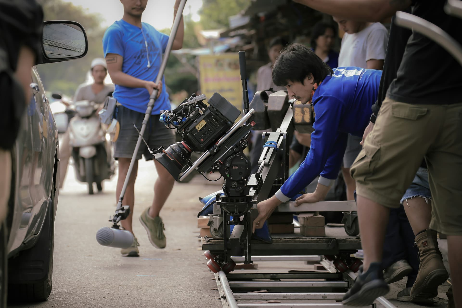 Camera crew street shoot dolly rig