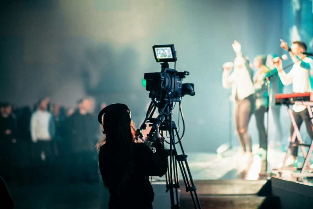 Concert event filming cameraman silhouette