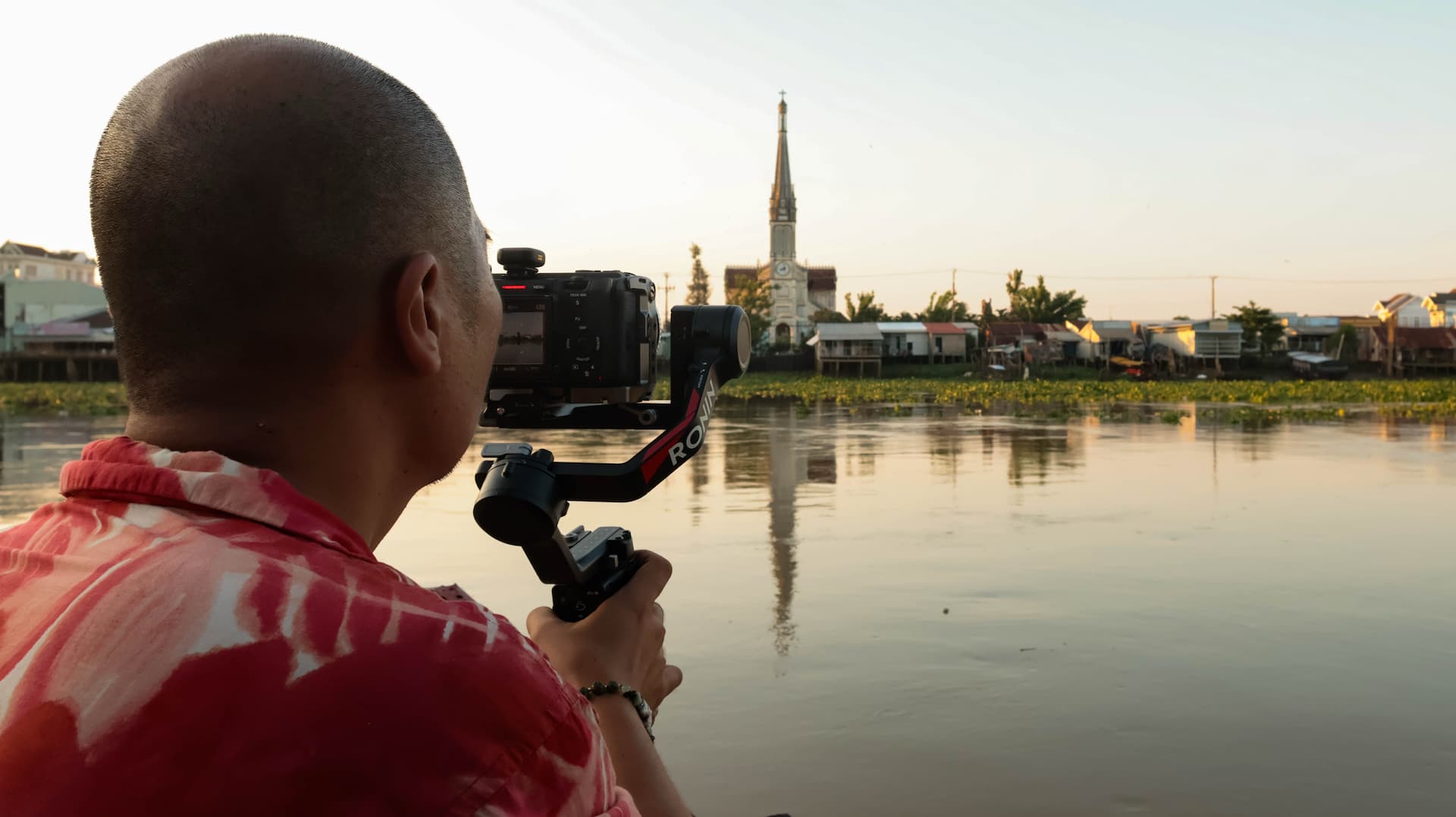 Documentary filming Mekong river church sunset