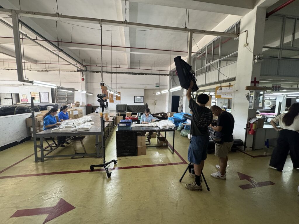 Garment factory filming crew workers