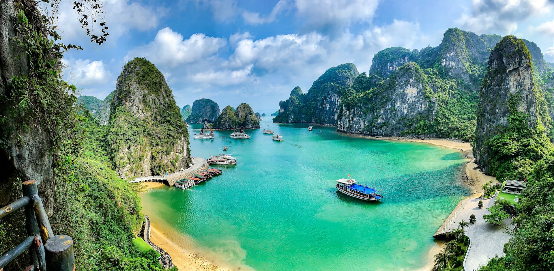 Tour boats among limestone islands in Ha Long Bay